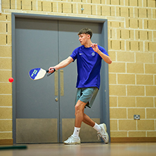 Sports hall with a person playing paddle sport