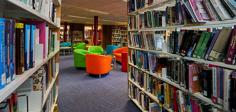 rows of books and colourful chairs