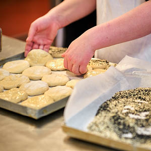 close up of students baking bread