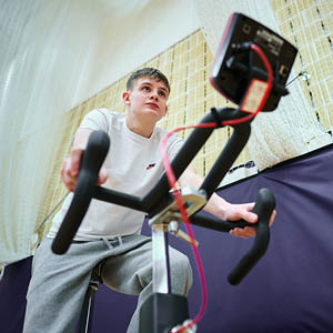 student on an exercise bike