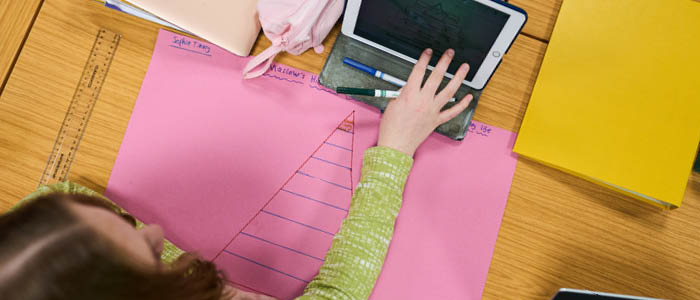 early years student on a laptop