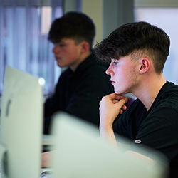 two students on mac computers