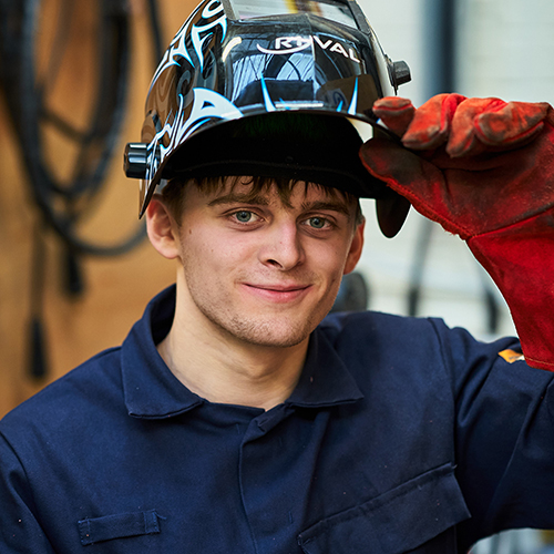 jason with his welding helmet lifted up