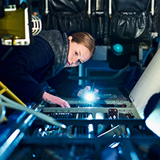 student looking at a plane using a torch