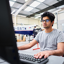 aircraft student working on a computer