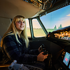 student sitting in an aircraft