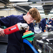 student buffing a car