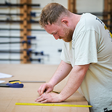 student in construction workshop