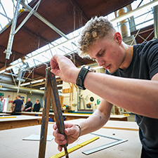 student in the wood workshop