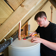 plumbing student fixing a boiler