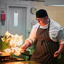 chef cooking in a pan