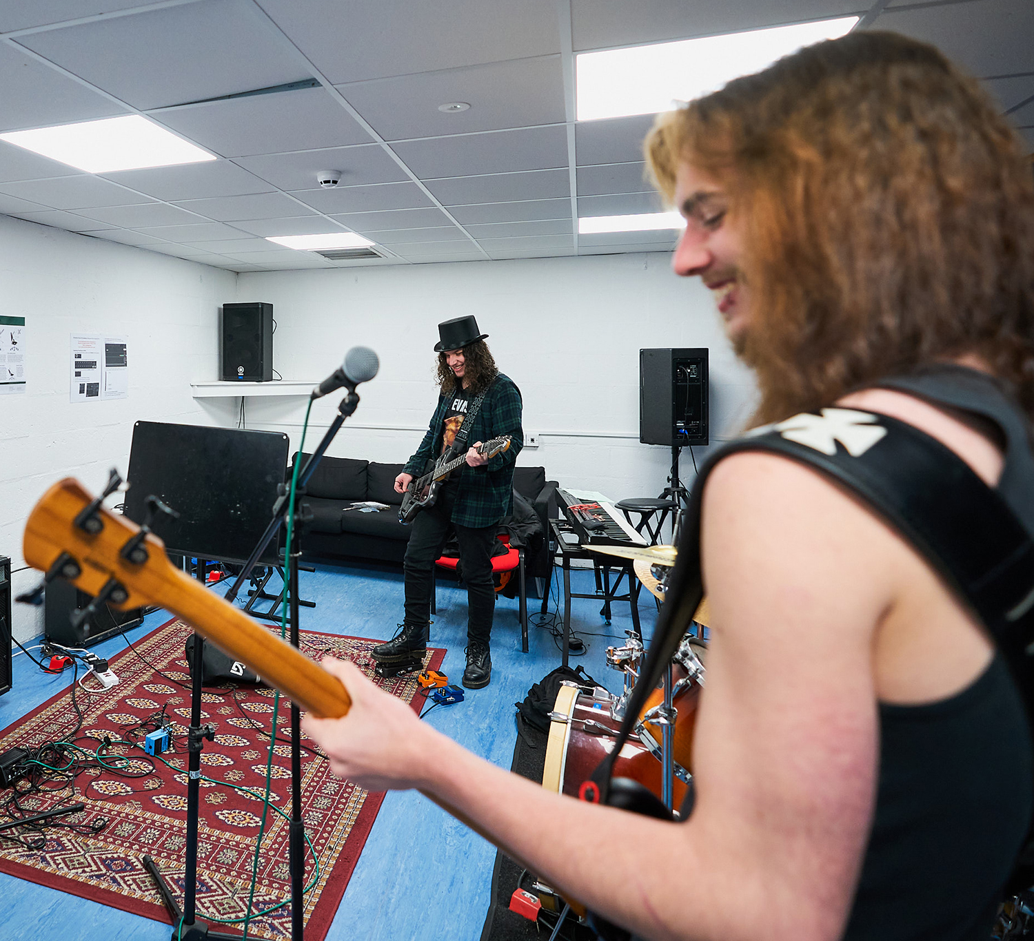 students performing in a rehearsal room